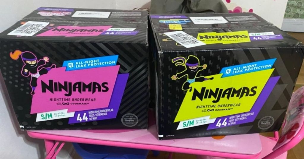2 boxes of Pampers Ninjamas on a kiddie table