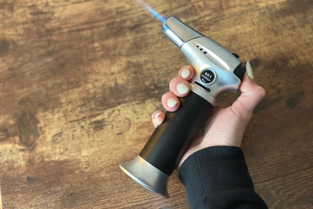 Holding a cooking torch