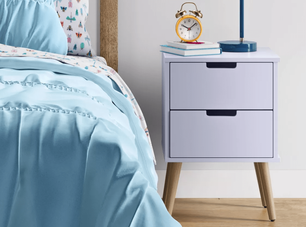 Pillowfort Nightstand next to a bed