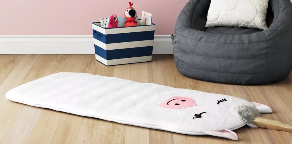 white unicorn plush pal pad on floor