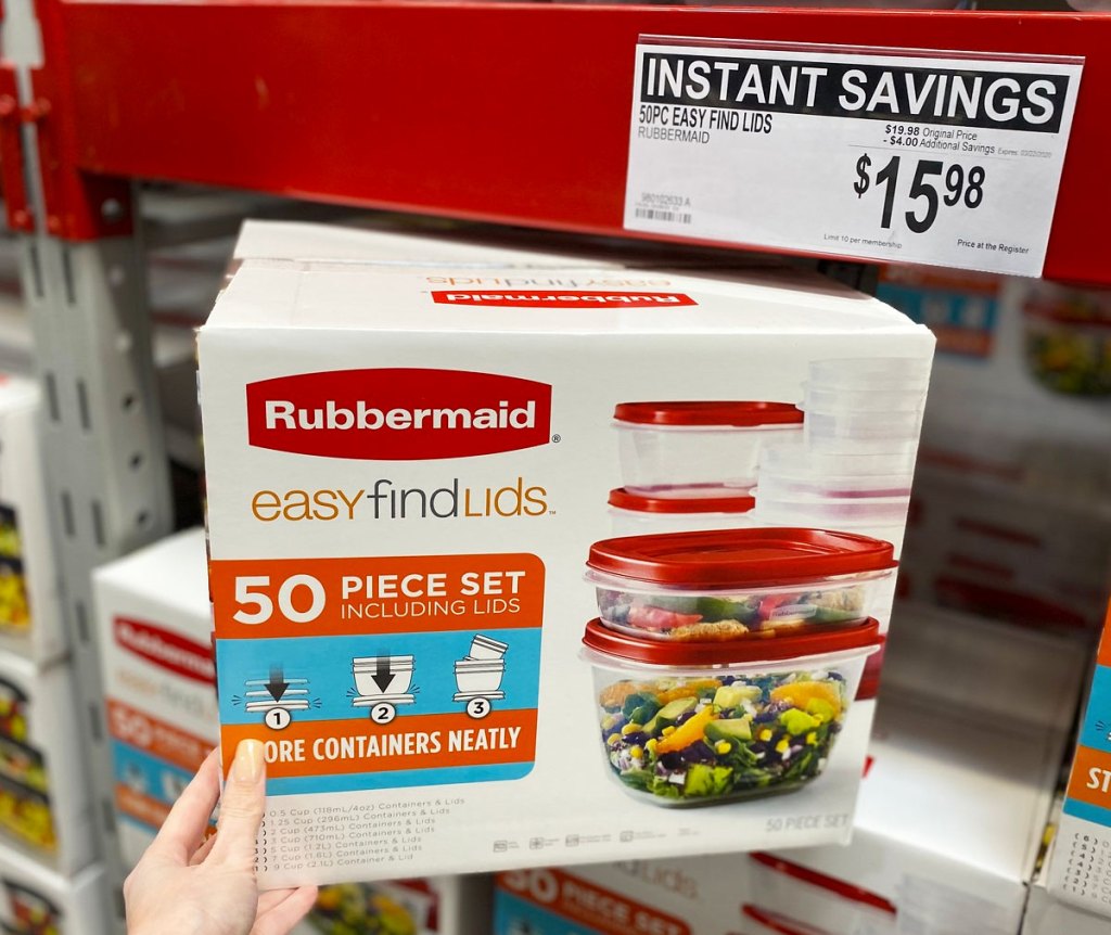 woman holding box of rubbermaid food storage containers at sams club