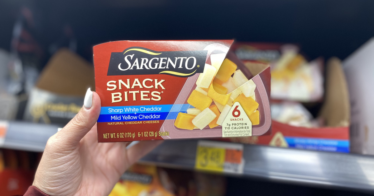 woman's hand holding up Sargento Snack Bites in store