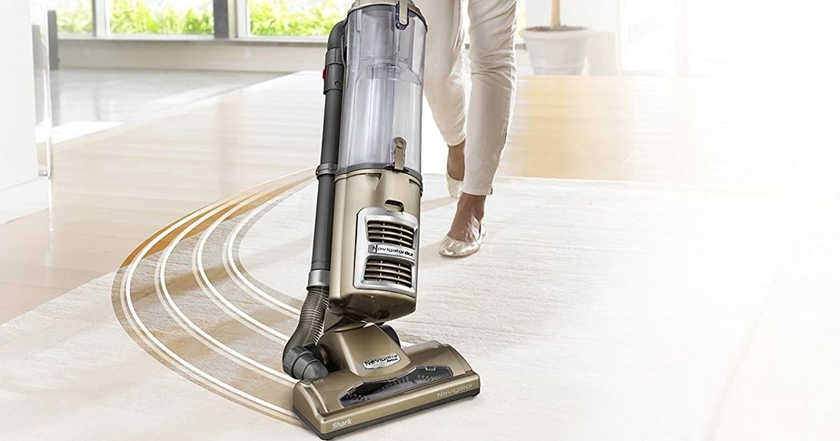 woman pushing a vacuum
