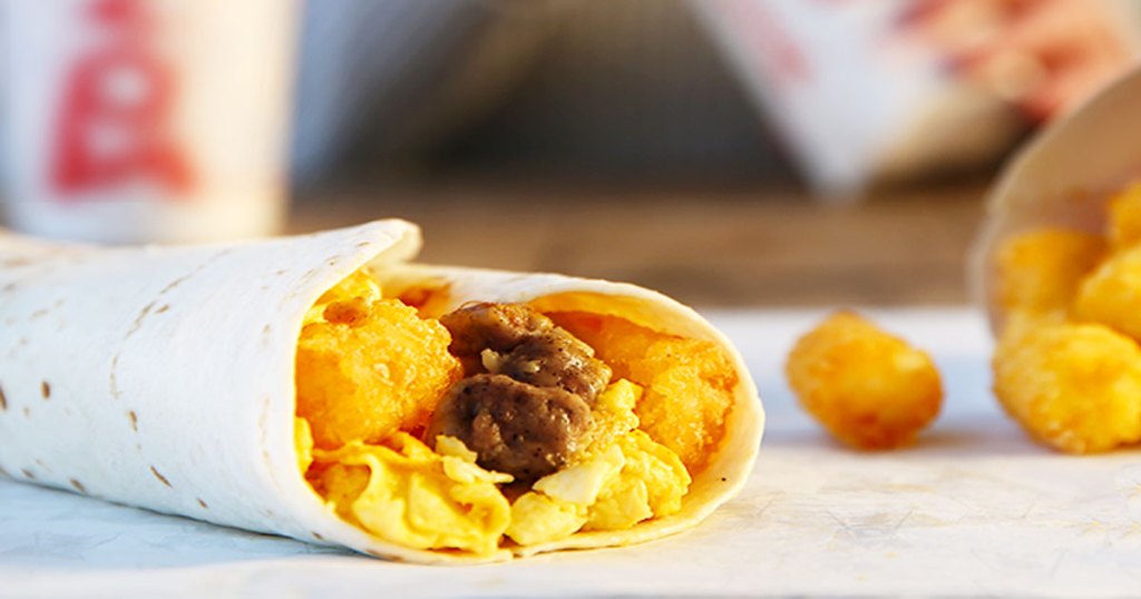 sonic breakfast burrito with tater tots in background