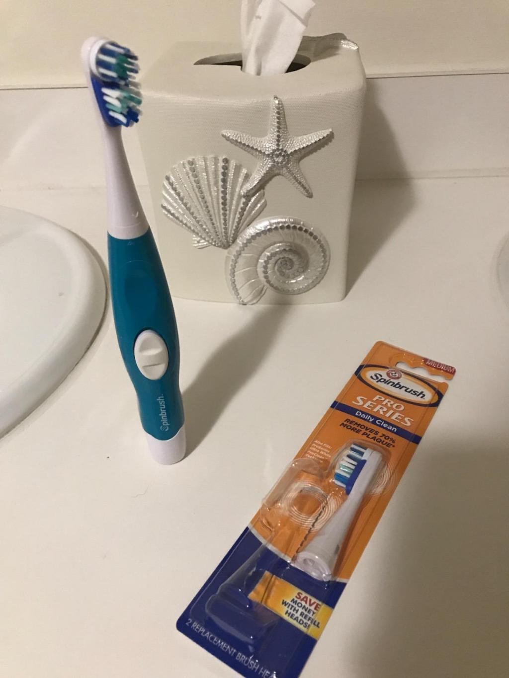 Spinbrush Pro Clean on bathroom shelf