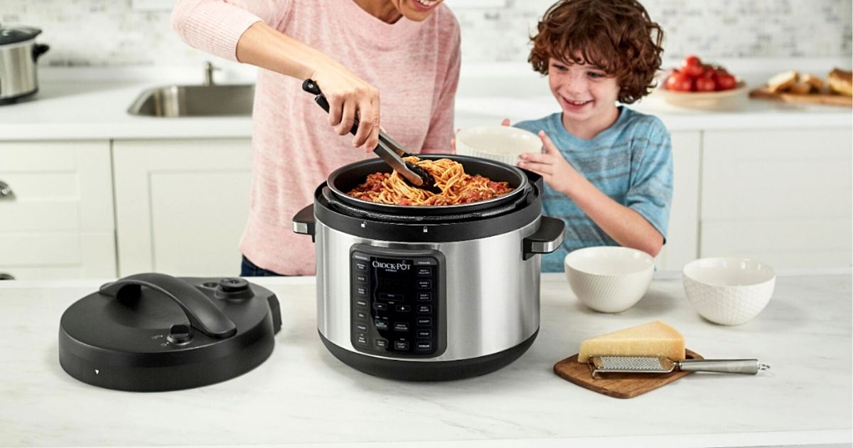woman and kid dishing out food from Crock-Pot