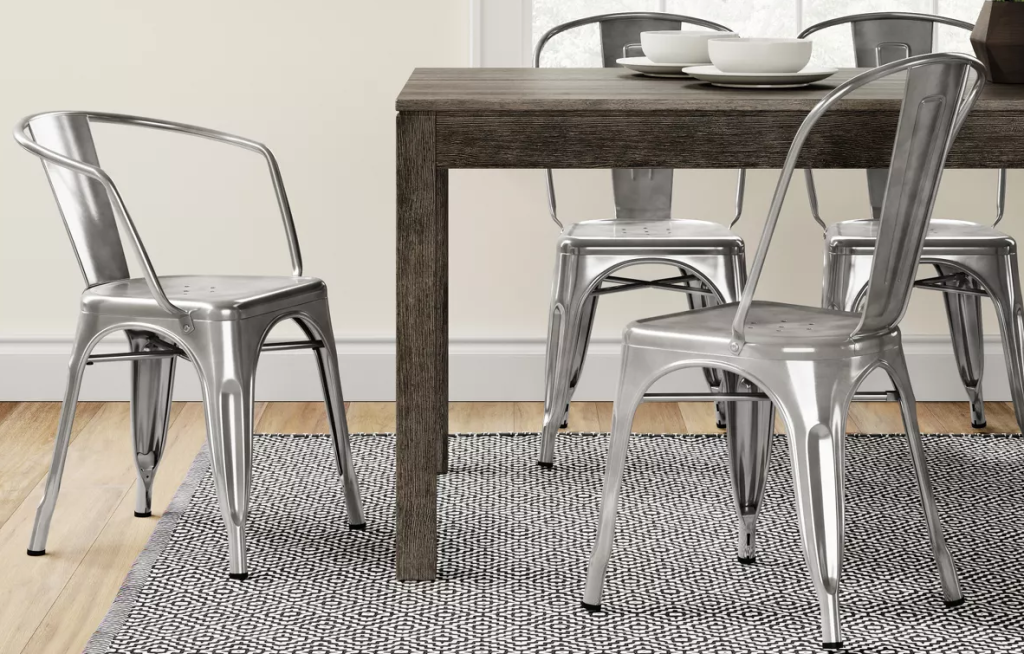 dining table with metal chairs around it