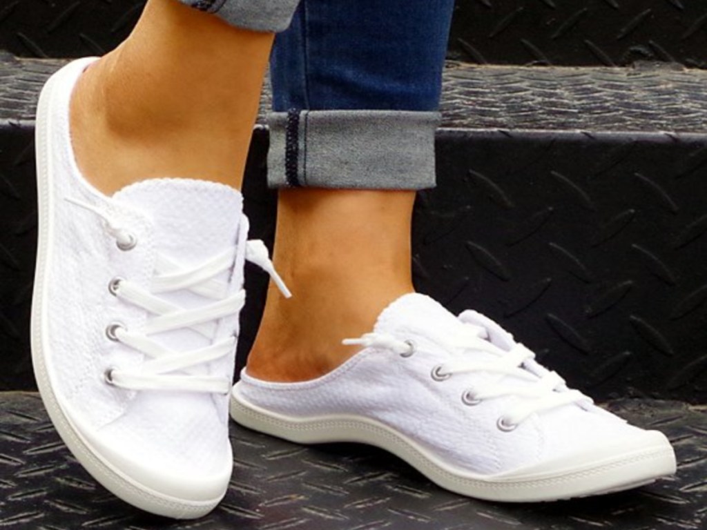 lady wearing white sneakers