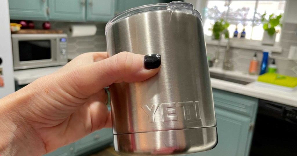 lady holding a yeti rambler in her kitchen