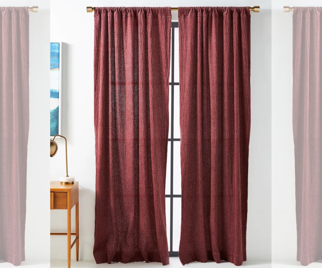 two anthro curtains in raspberry