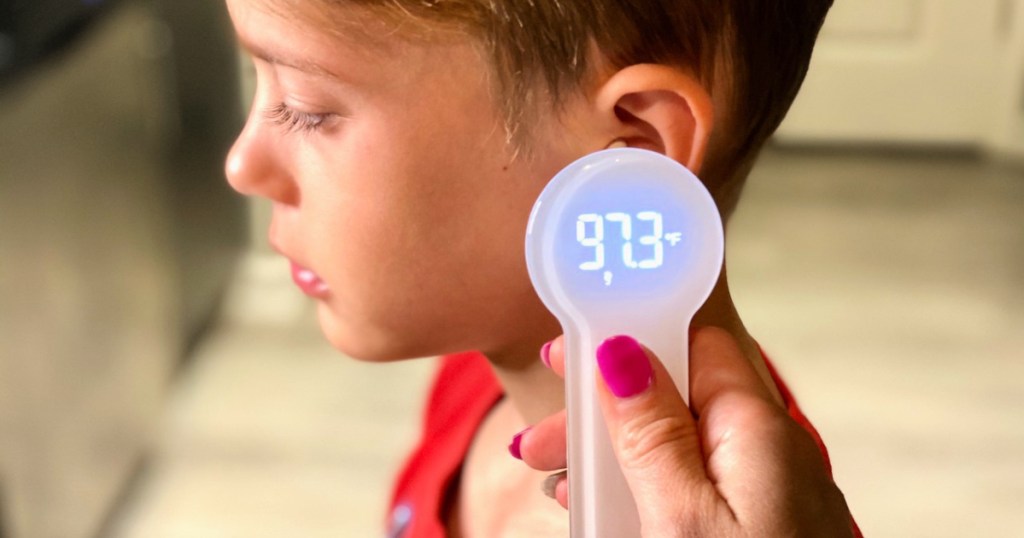 boy with thermometer to ear