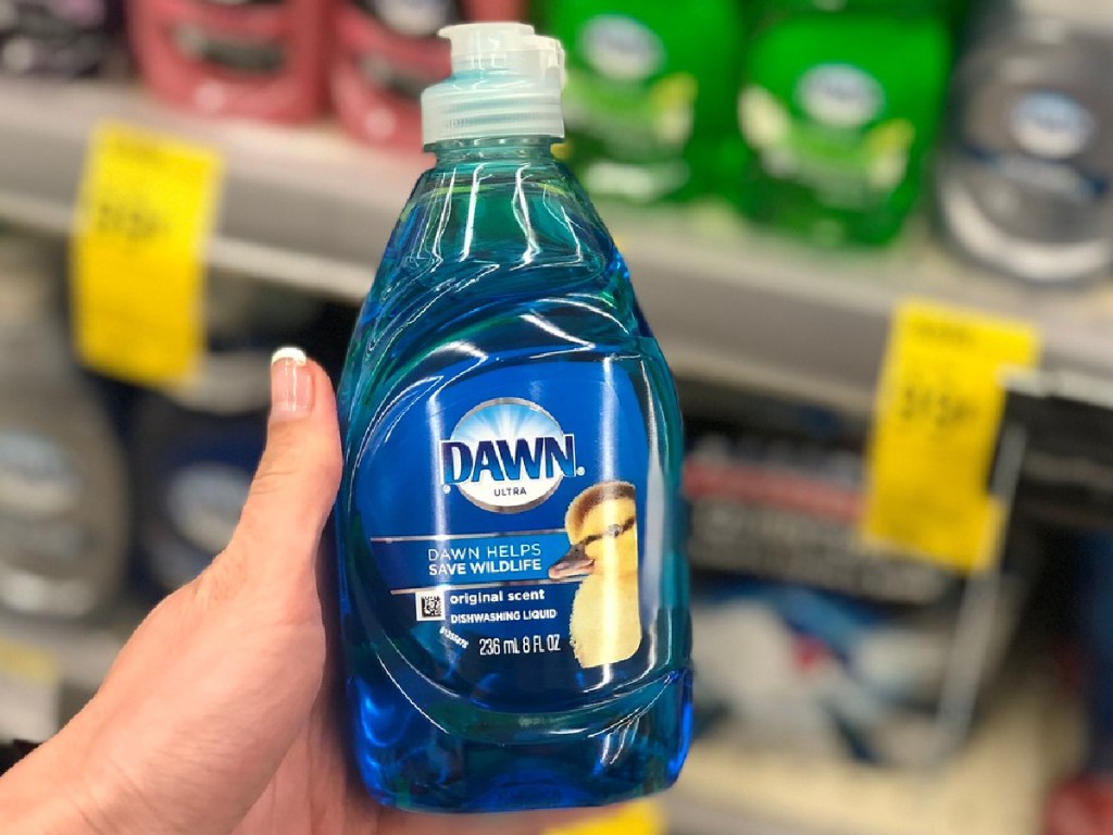 hand holding bottle of dish liquid in store