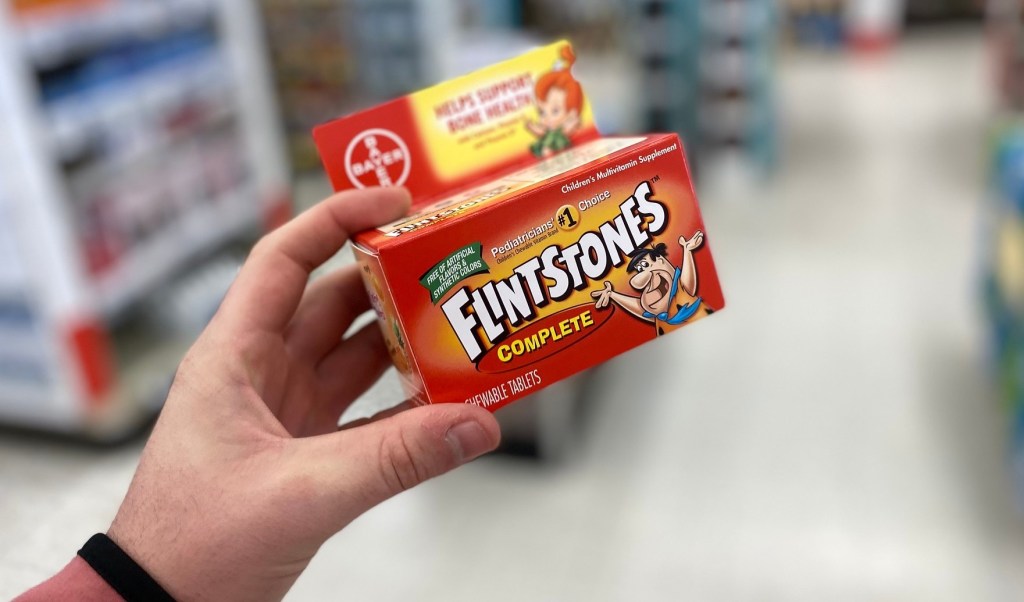 flinstones complete vitamins in hand in store at walgreens