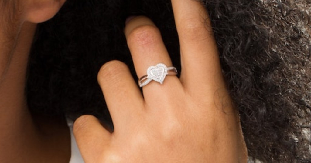 heart diamond ring on finger