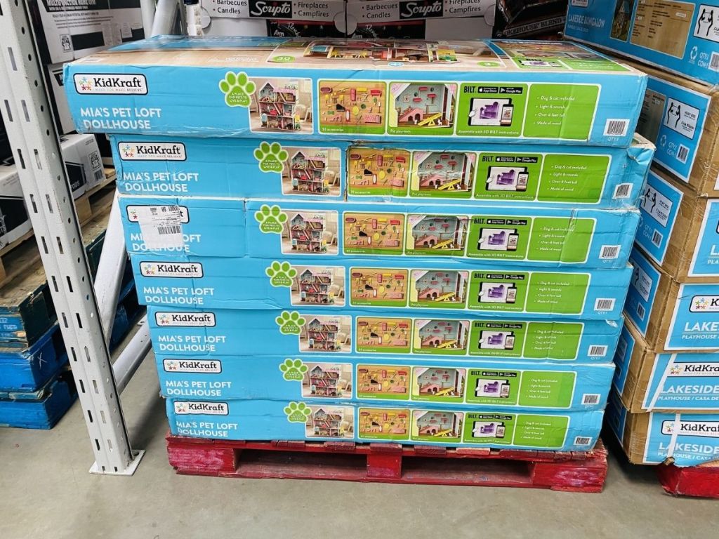 Mia's playhouse packages stacked on palette in store