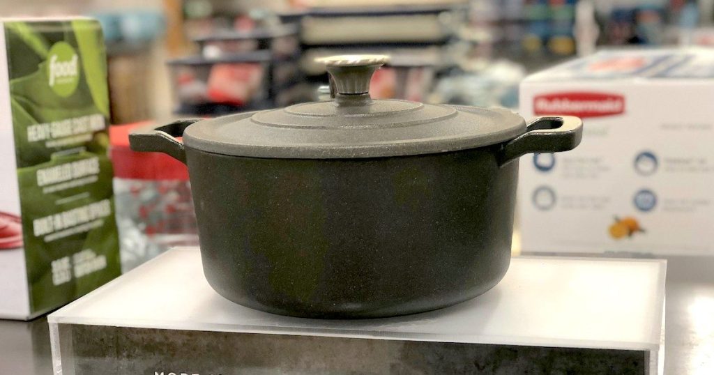 black cast iron dutch oven sitting on store display