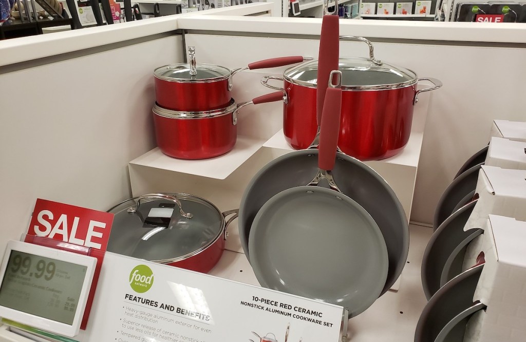 set of red pots and pans in store display