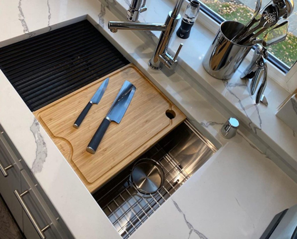 undermount kitchen sink with custom cutting board kitchen organization idea