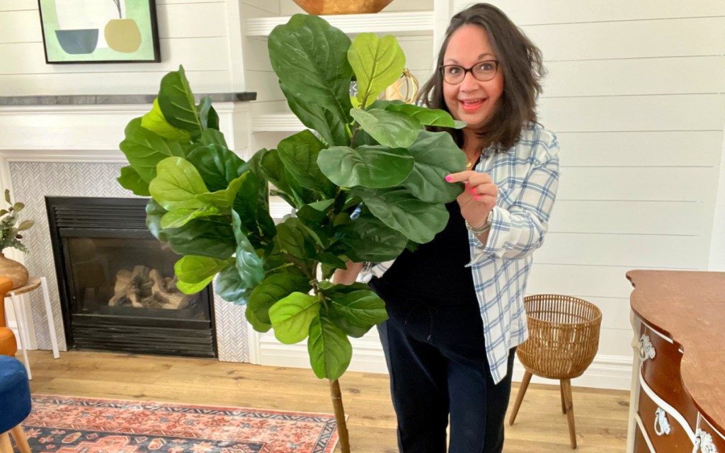 woman with faux fiddler plant