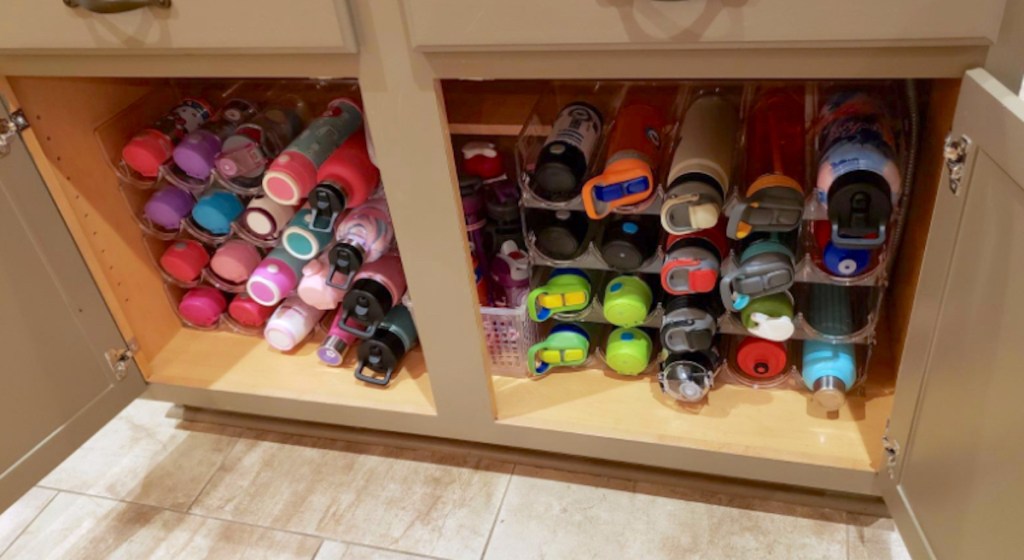 tons of water bottles in cabinet for pantry organization ideas