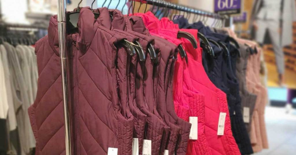 rack of women's vests in multiple colors