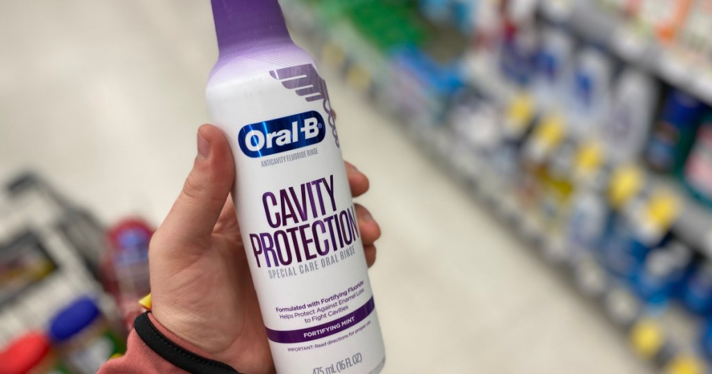 oral b cavity protection mouthwash in hand in store at walgreens