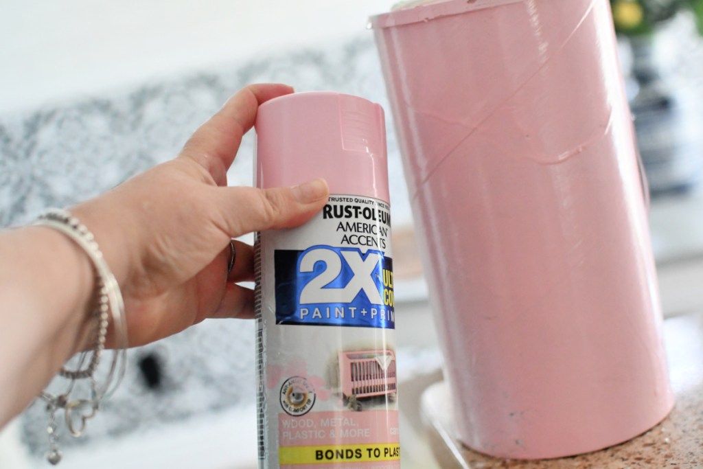 painting an oatmeal canister pink
