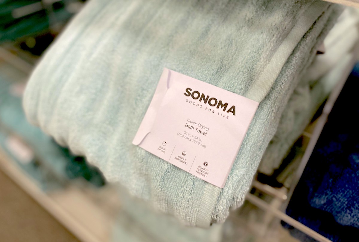 close up of light blue bath towel with tag