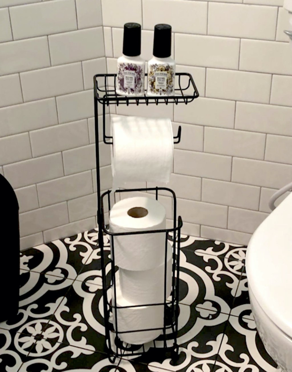 black iron toilet paper holder as bathroom storage idea