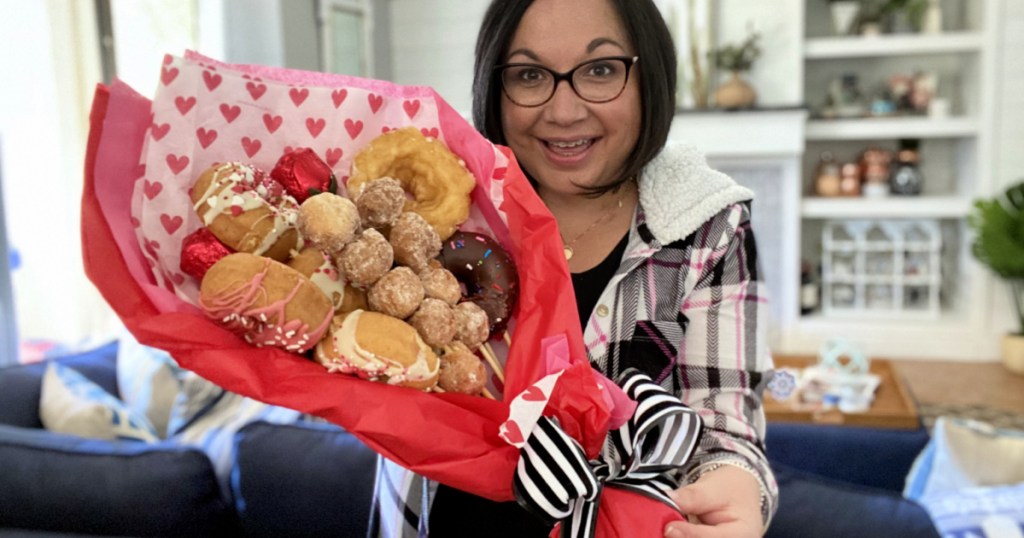 woman holding a DIY donut bouquet 