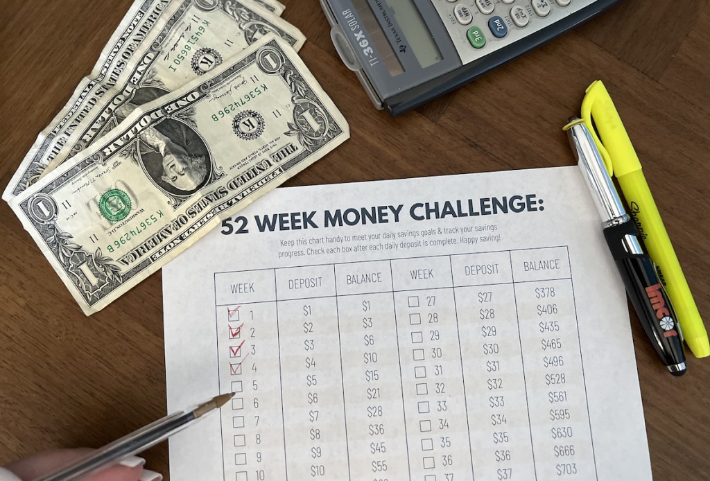 money saving 52 week money savings challenge printable with cash and calculator