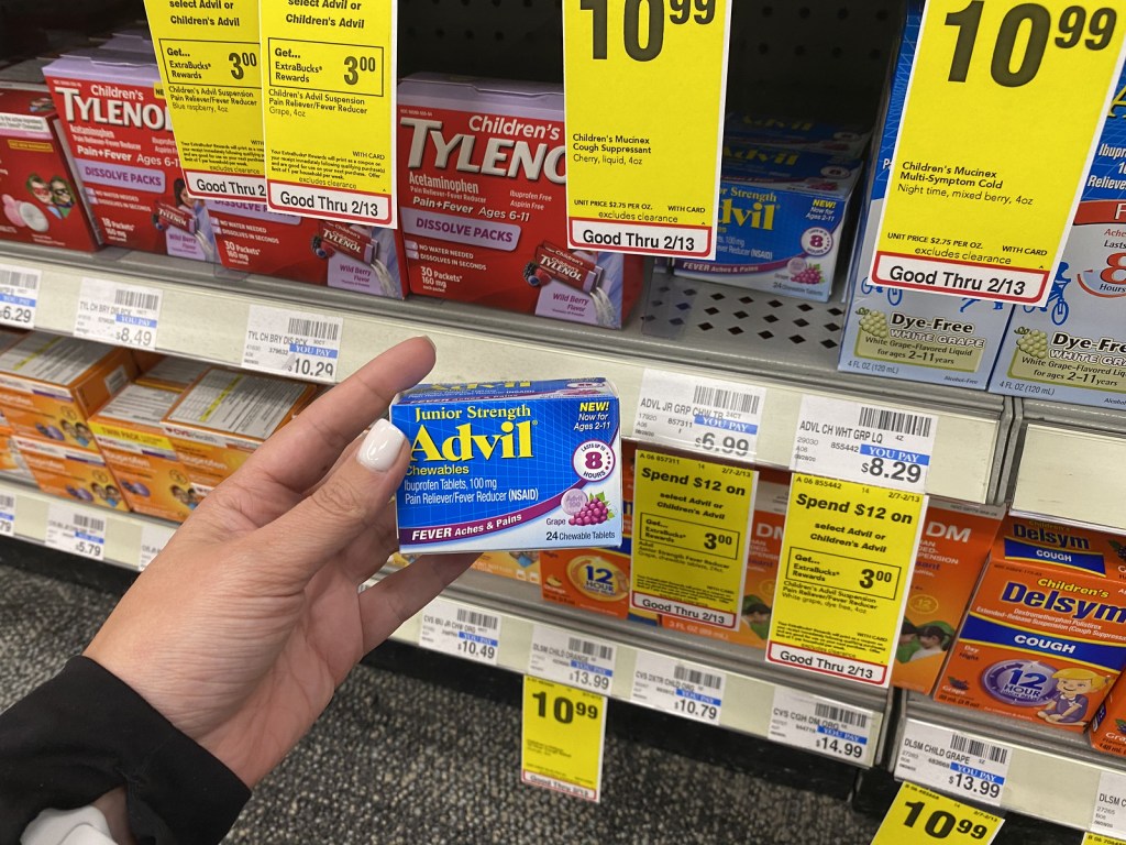 Woman holding a box of Advil Children's Tablets in store