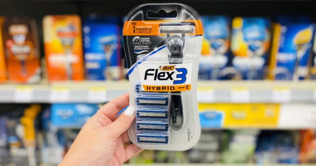 woman holding up package of bic flex3 disposable razors