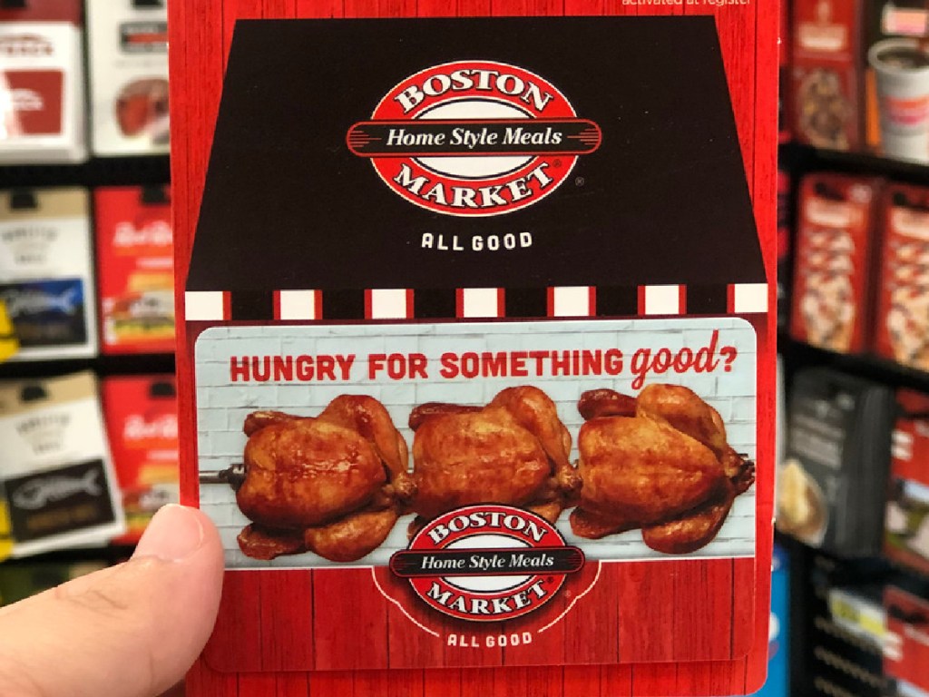 hand holding gift card to Boston Market