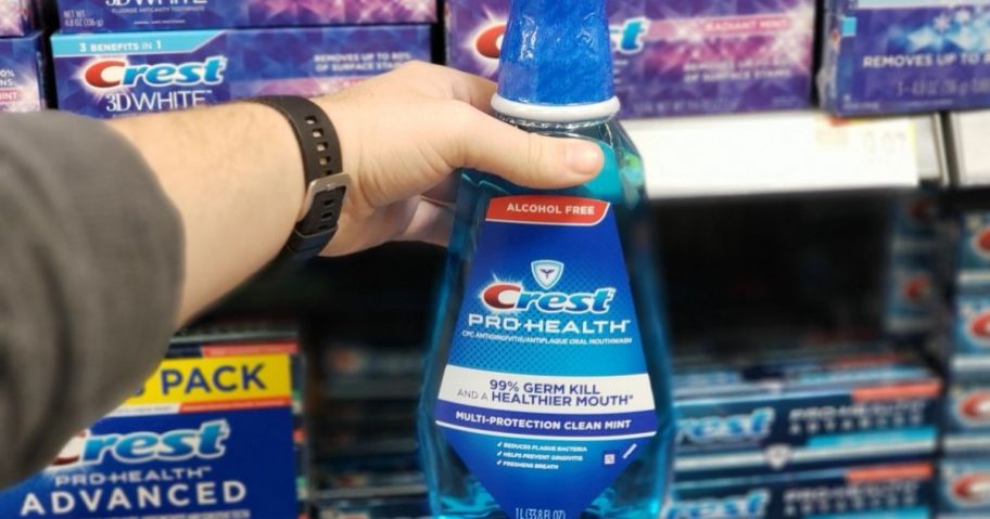 hand holding Crest Pro Health Mouthwash