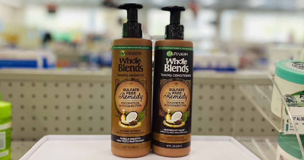 two brown bottles of shampoo on shelf 