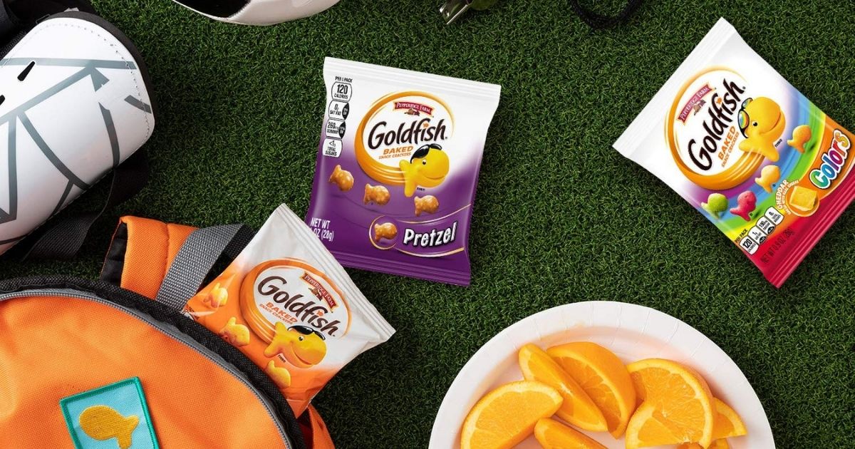packs of goldfish crackers spilling out of a backpack on AstroTurf