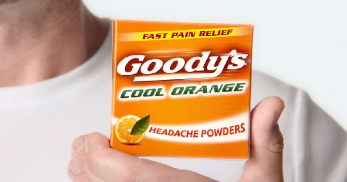 man in a white tee holding an orange box of Goody's Pain Relief