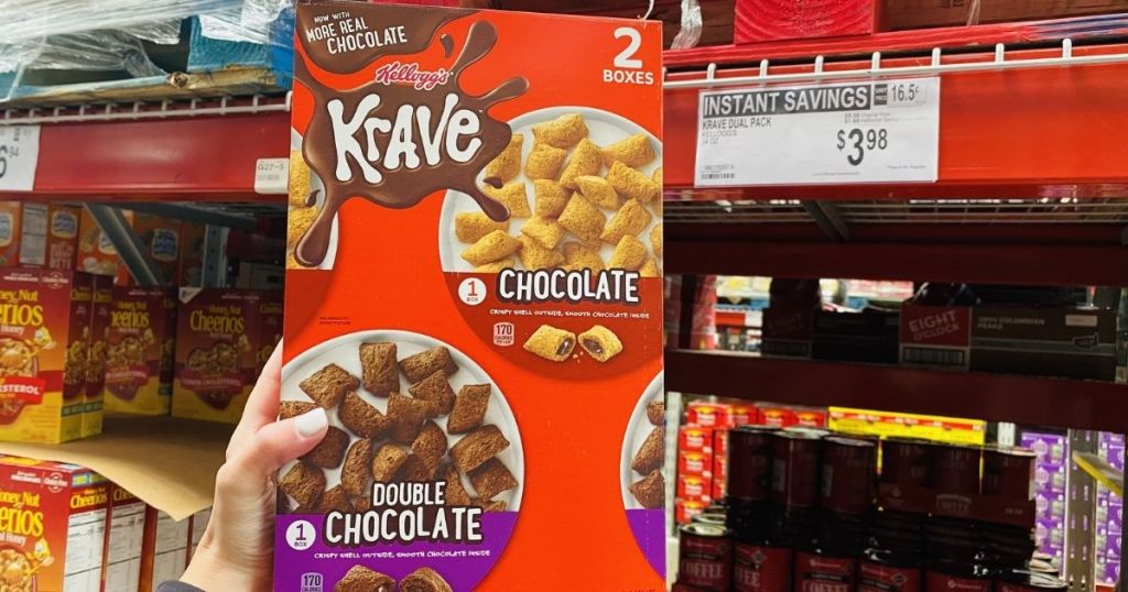 hand holding a box of Kellogg's Krave cereal