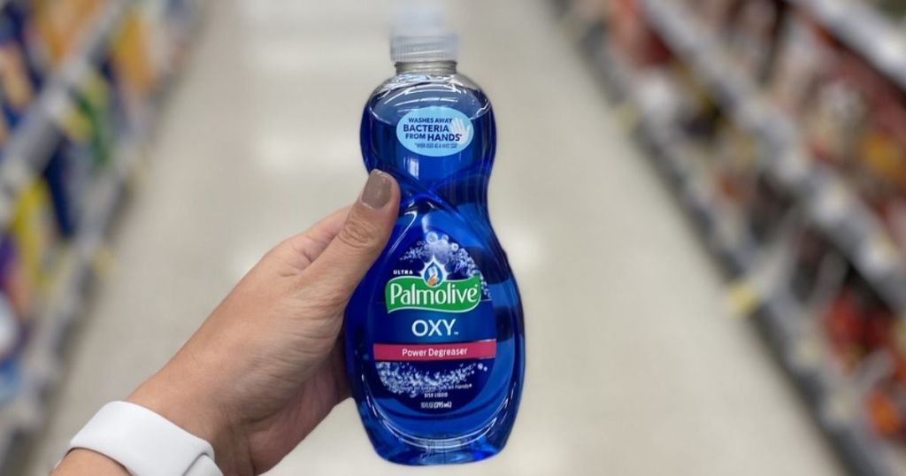 hand holding Palmolive Dish Liquid in store aisle