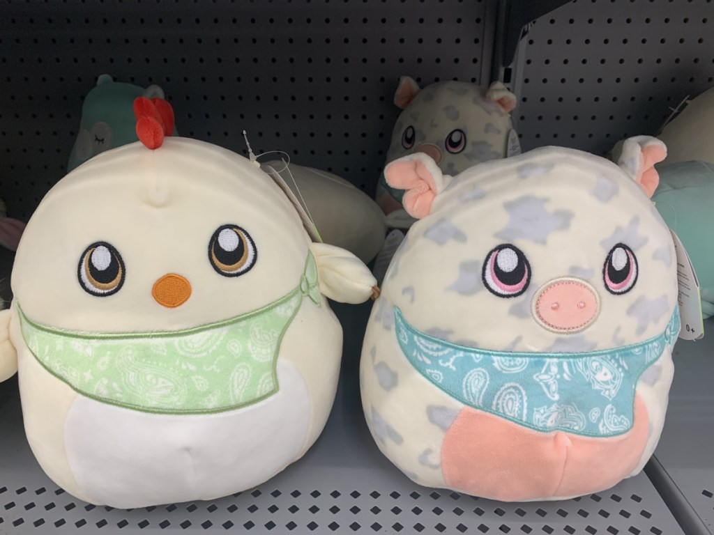 chicken and pig plush animals on store shelf