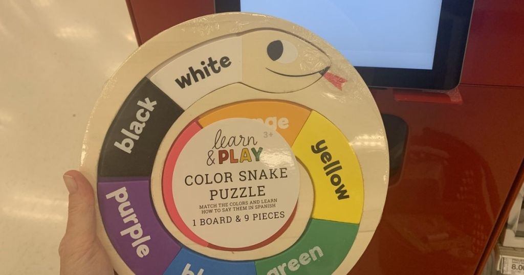 hand holding Target Learn & Play Color Snake Puzzle