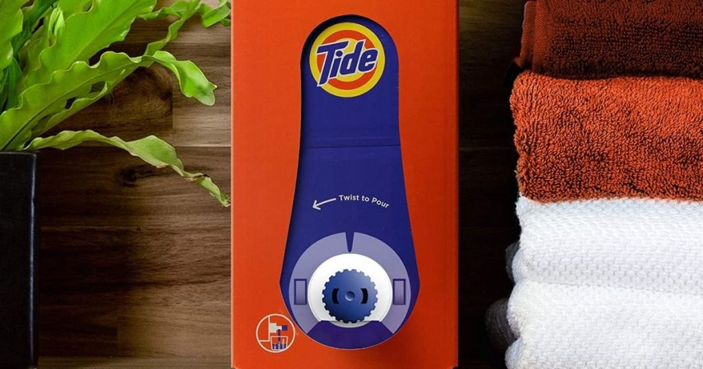 Tide Liquid Detergent Eco-Box with towels and plant