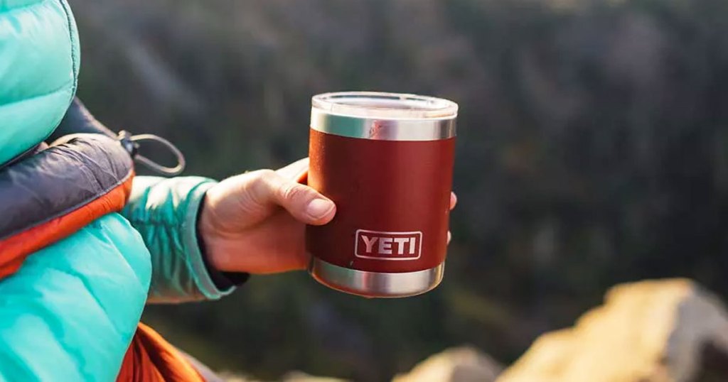 person holding a red yeti cup