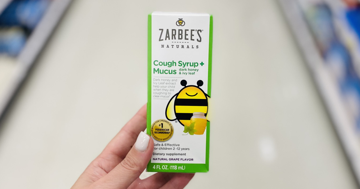 hand holding a box of zarbees cough syrup