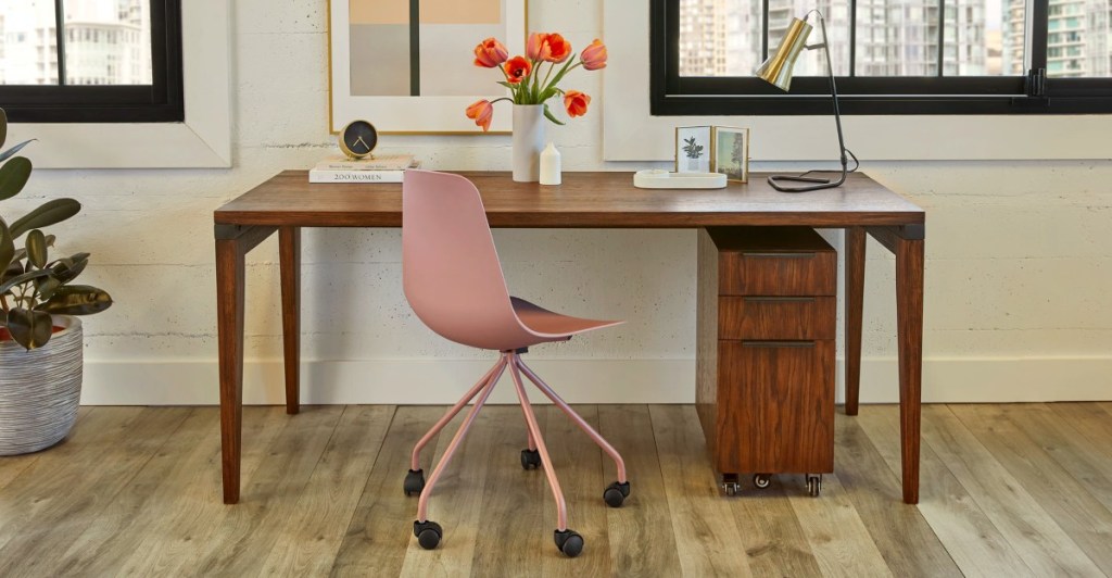 office with wooden desk and pink chair