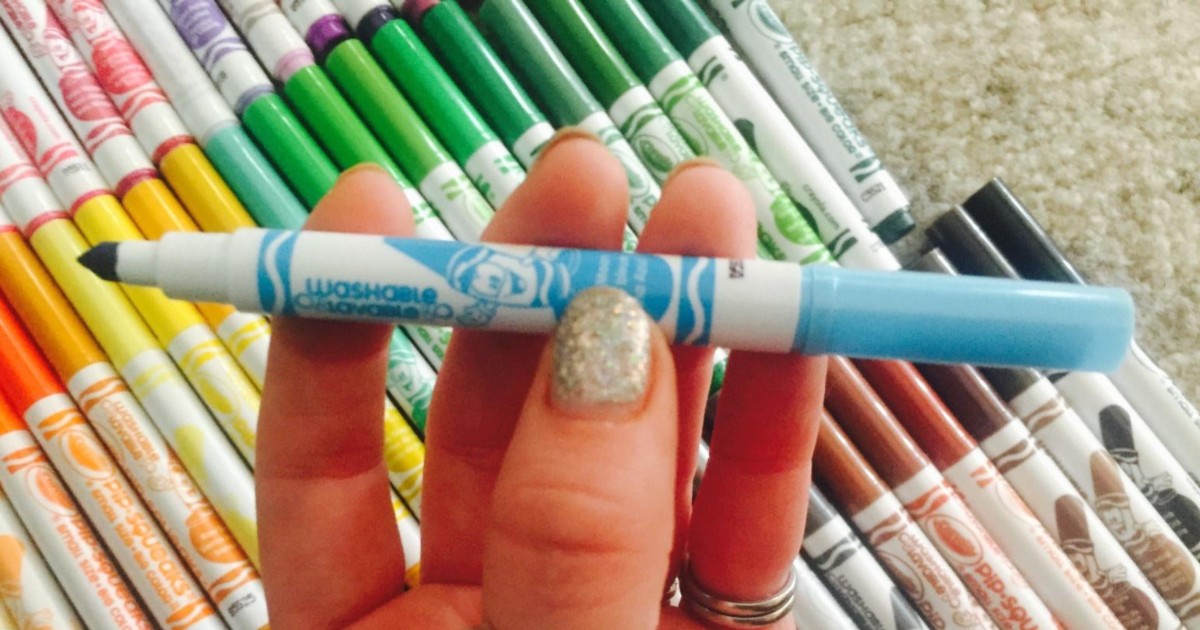 holding a thin blue marker