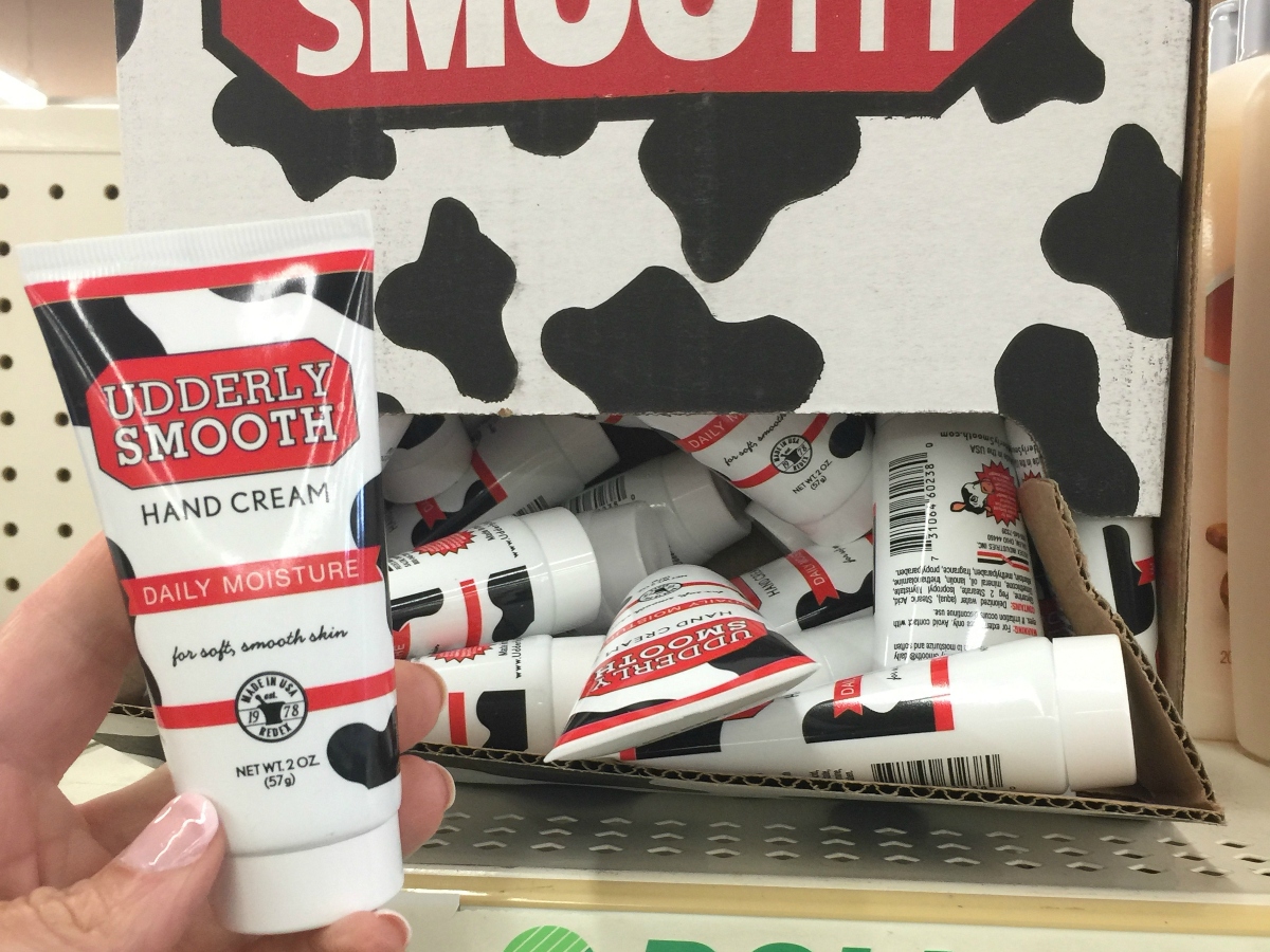 holding udderly smooth hand cream tube