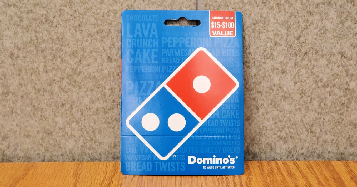 domino's gift card sitting on table against wall 