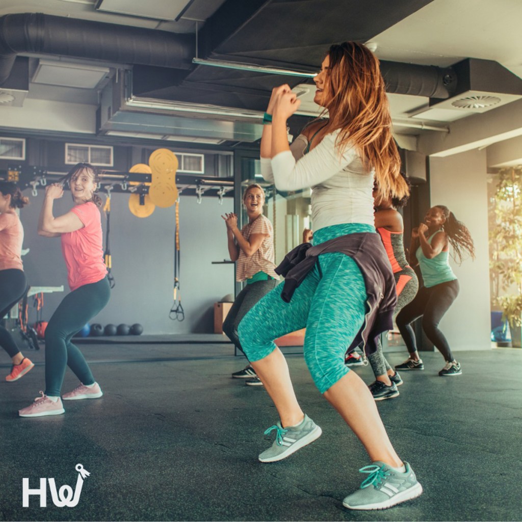 woman doing workout class for healthy wage